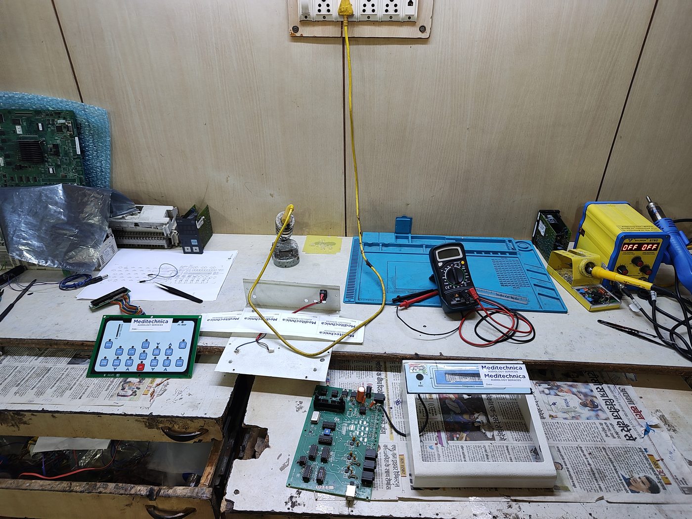 Control panel circuit board under test after repair